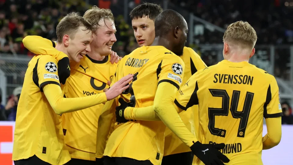 Serhou Guirassy of Borussia Dortmund celebrating a goal with his teammates